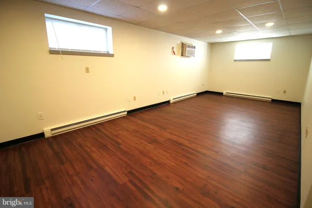 an empty room with wooden floor