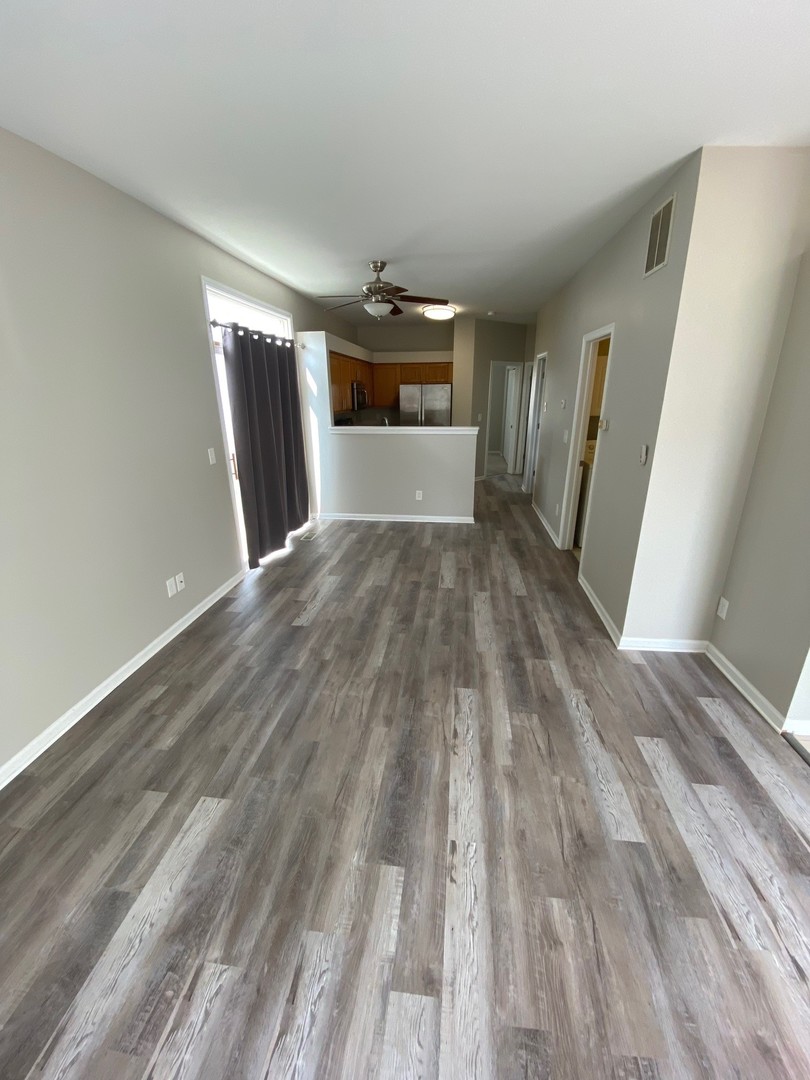 318 Richfield Trail Romeoville, IL 60446 - Photo 2 of 9 a view of empty room with wooden floor