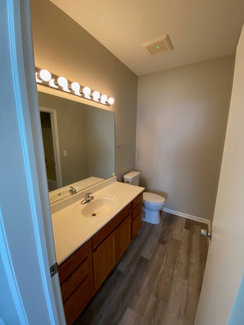 318 Richfield Trail Romeoville, IL 60446 - Photo 5 of 9 a bathroom with a sink and mirror
