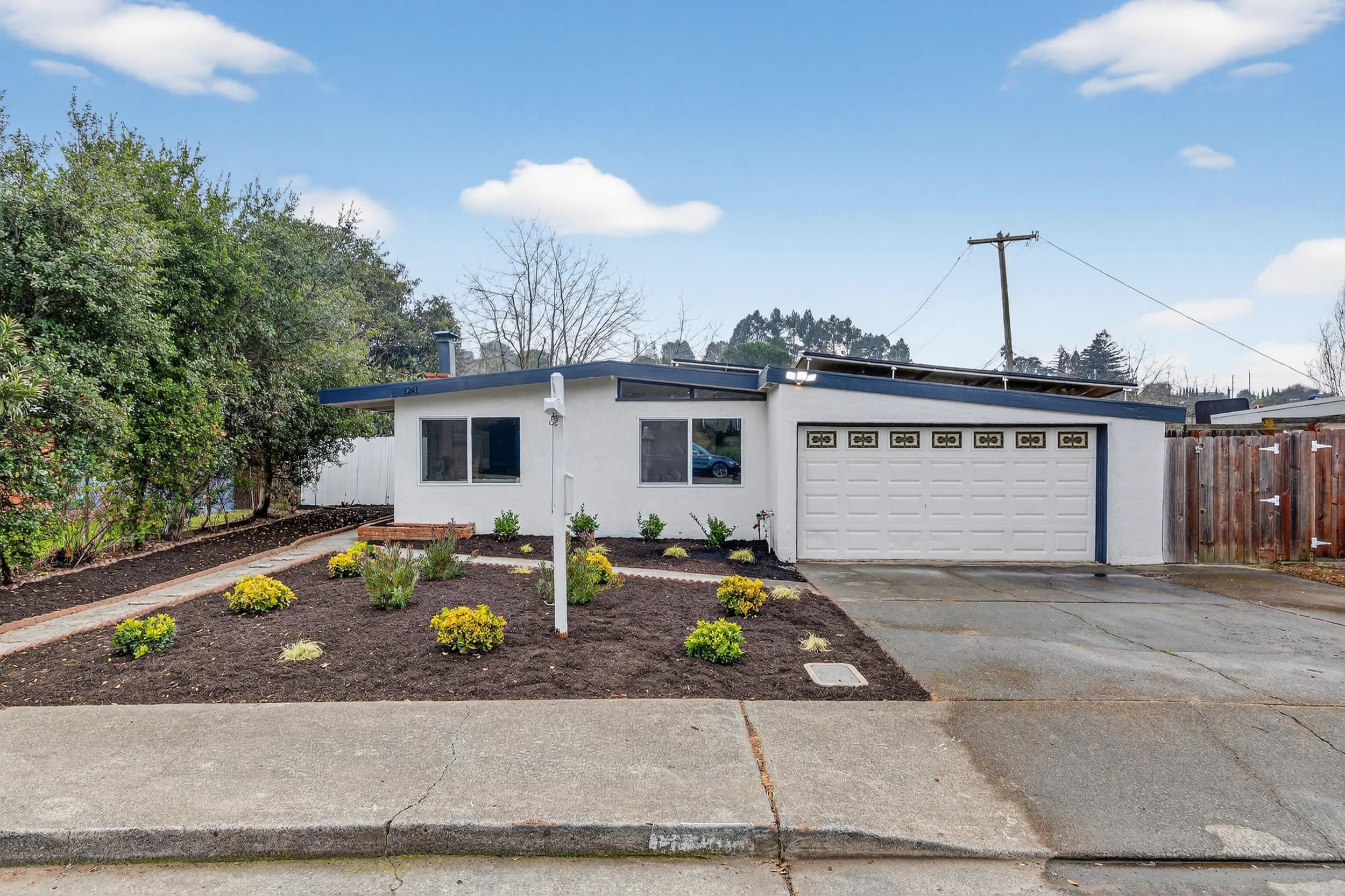 1241 Coronel Avenue Vallejo, CA 94591 - Photo 1 of 11 Mid-century inspired home with stucco siding, driveway, and an attached garage