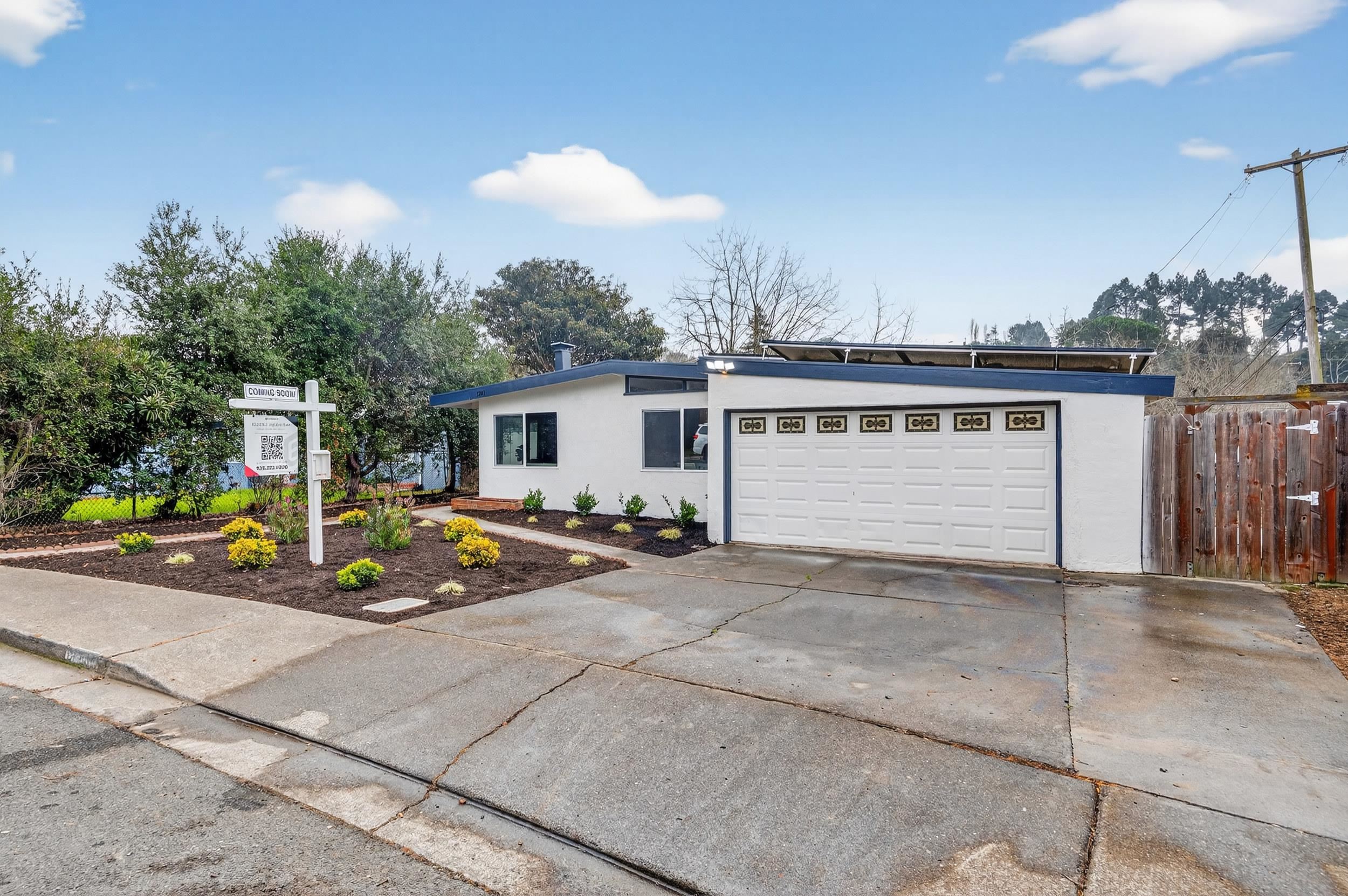 1241 Coronel Avenue Vallejo, CA 94591 - Photo 2 of 11 Mid-century home with stucco siding, driveway, and an attached garage