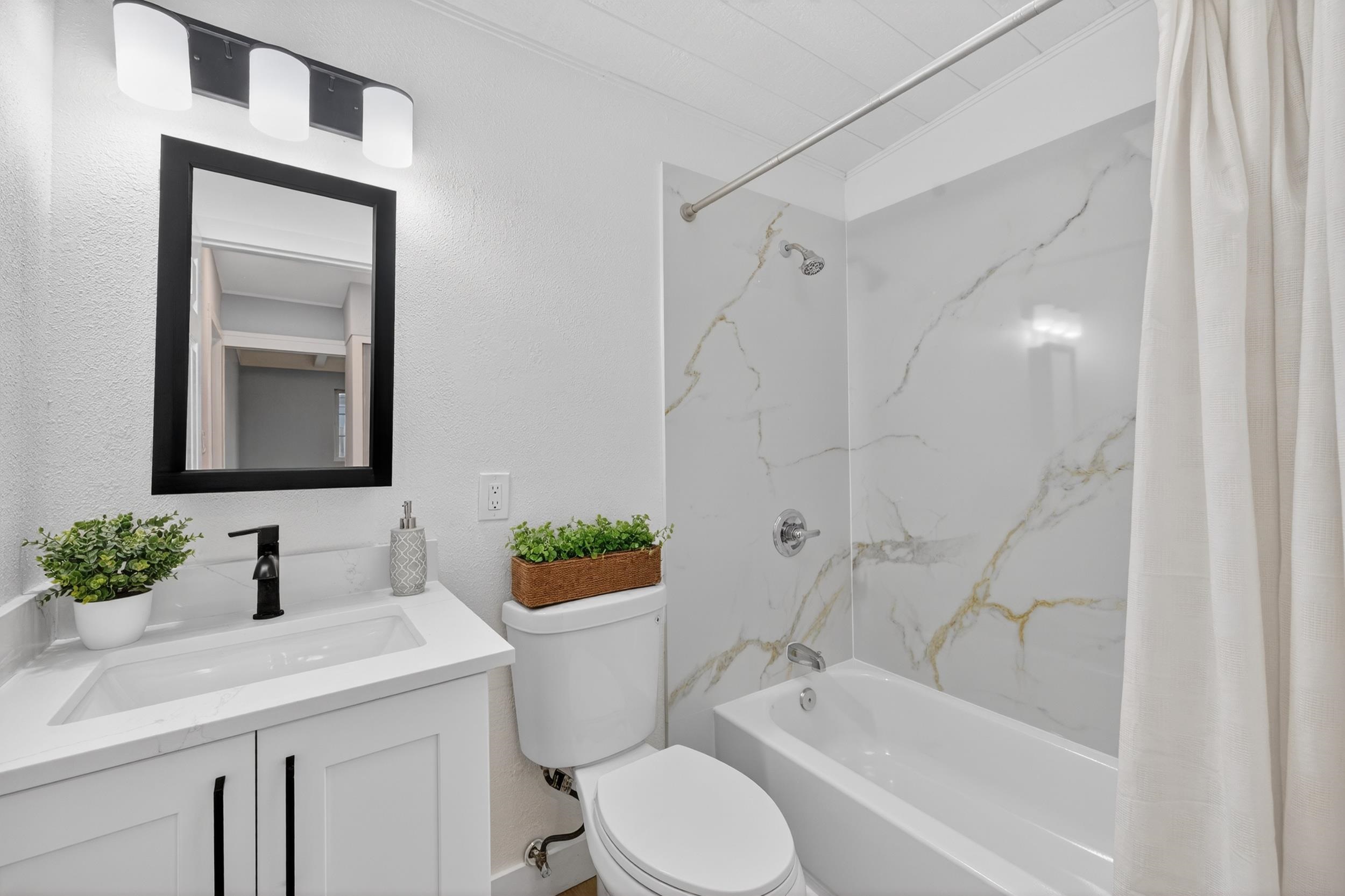 1241 Coronel Avenue Vallejo, CA 94591 - Photo 8 of 11 Bathroom with shower / bathtub combination with curtain, vanity, and a textured wall