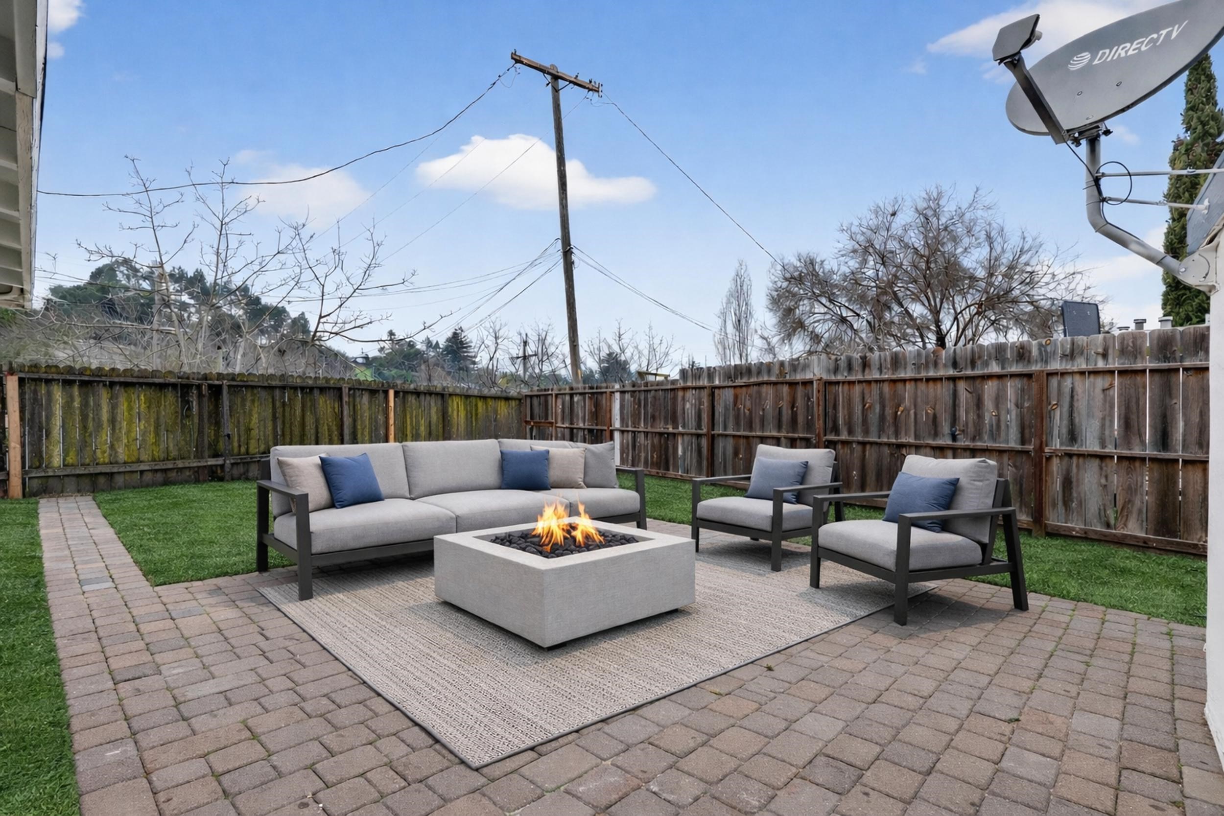 1241 Coronel Avenue Vallejo, CA 94591 - Photo 10 of 11 Fenced backyard featuring an outdoor living space with a fire pit and a patio