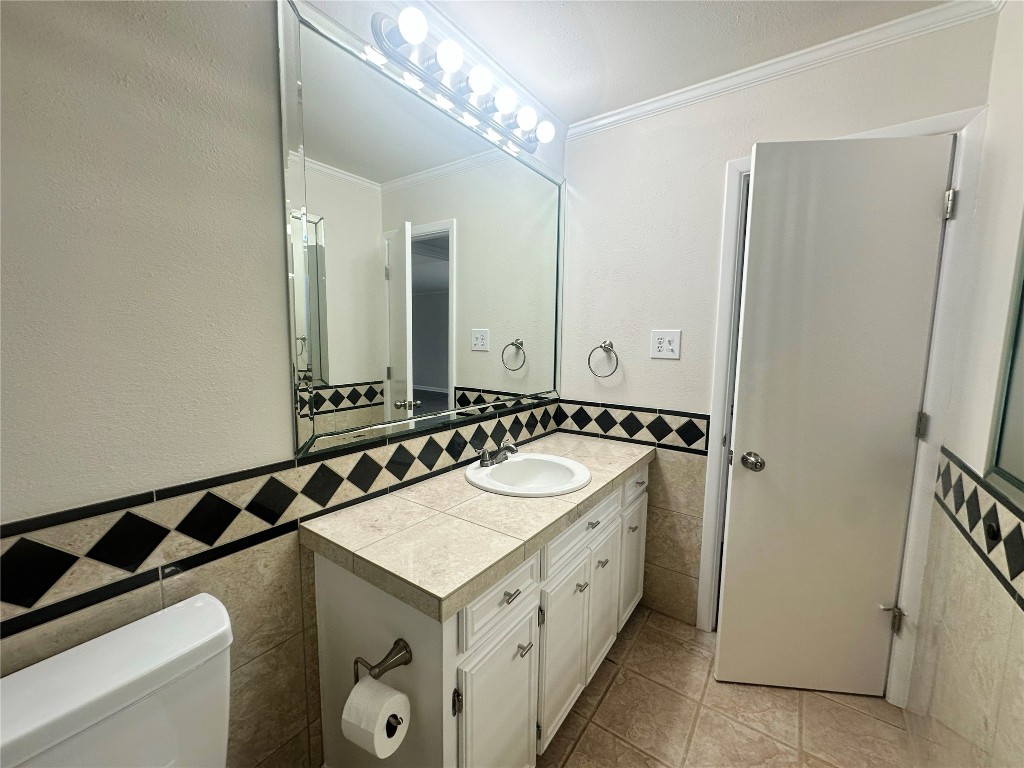 130 Bay Ridge Drive Baytown, TX 77523 - Photo 11 of 20 a bathroom with a sink and a mirror