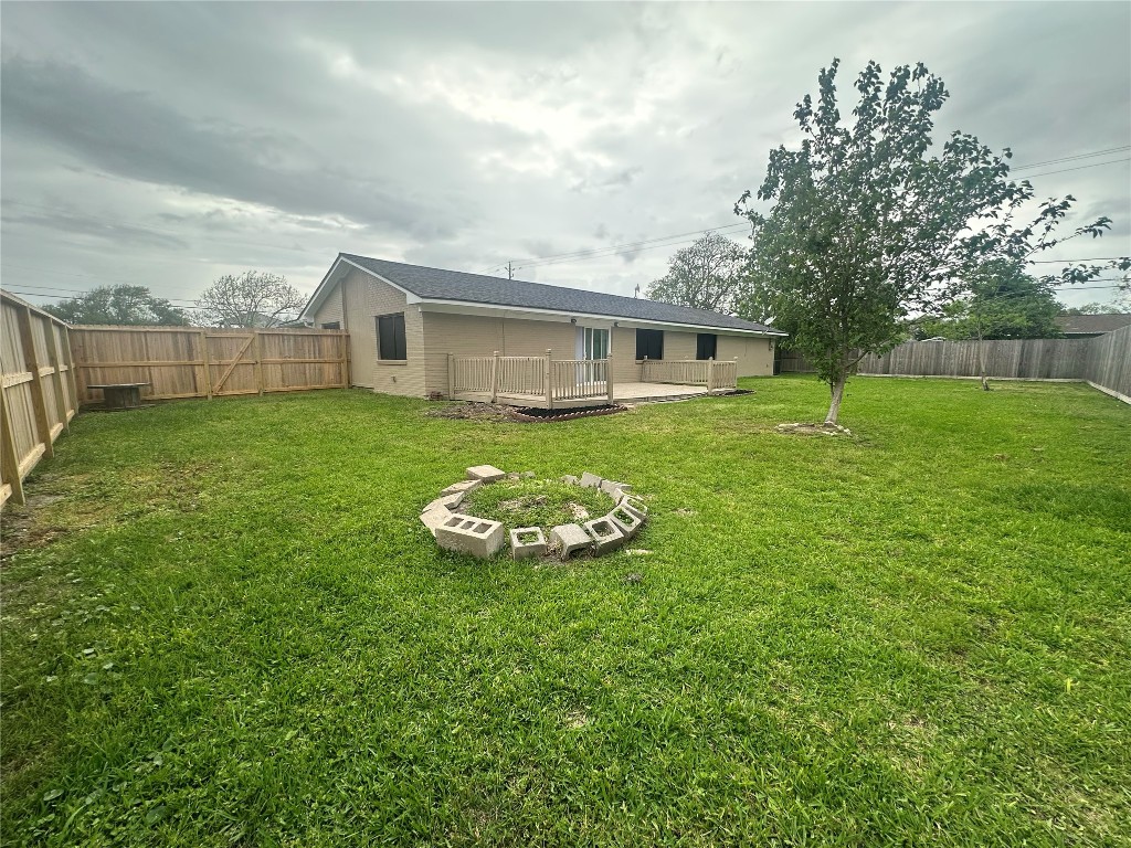 130 Bay Ridge Drive Baytown, TX 77523 - Photo 18 of 20 a view of a house with a backyard