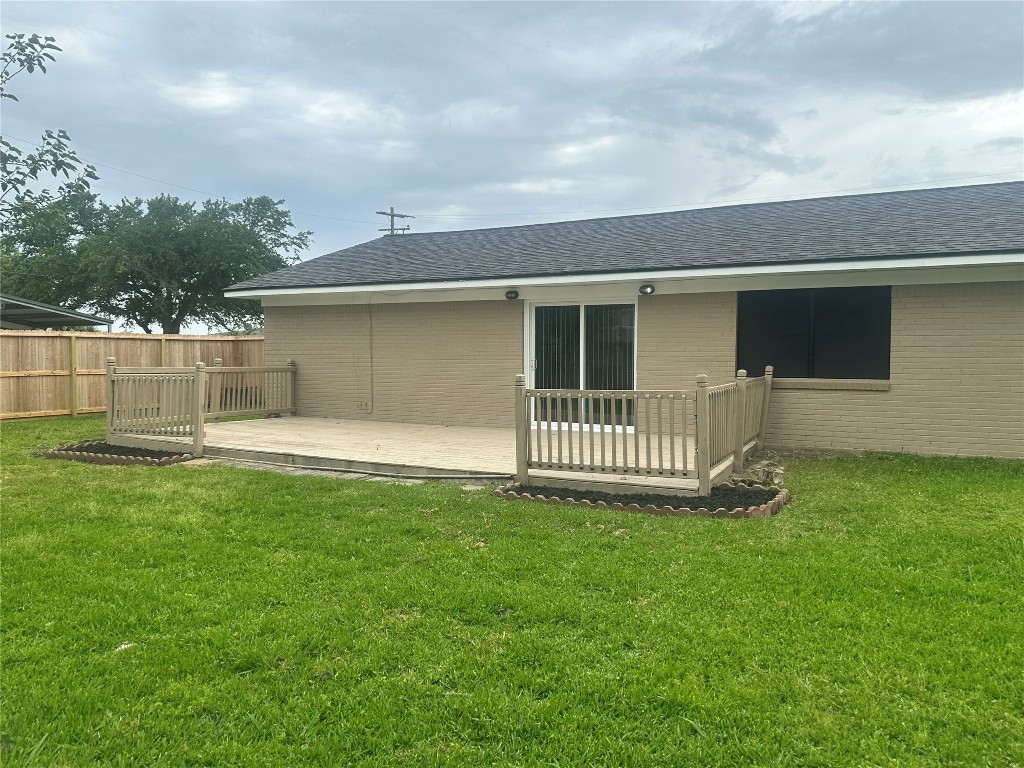 130 Bay Ridge Drive Baytown, TX 77523 - Photo 19 of 20 a view of a house with a backyard