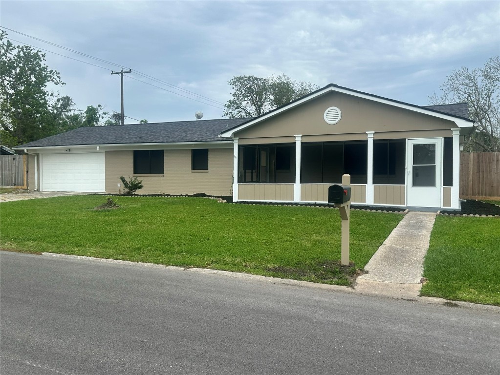 130 Bay Ridge Drive Baytown, TX 77523 - Photo 2 of 20 a front view of house with yard and green space
