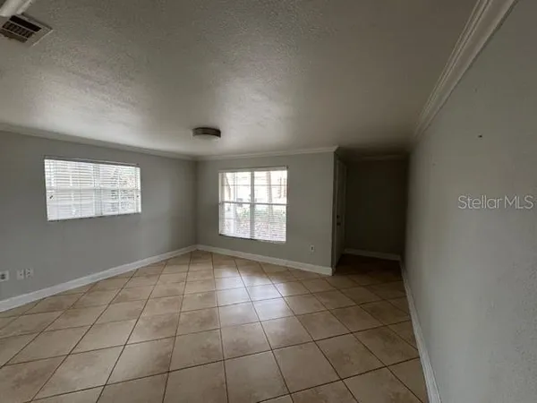 a view of an empty room and window