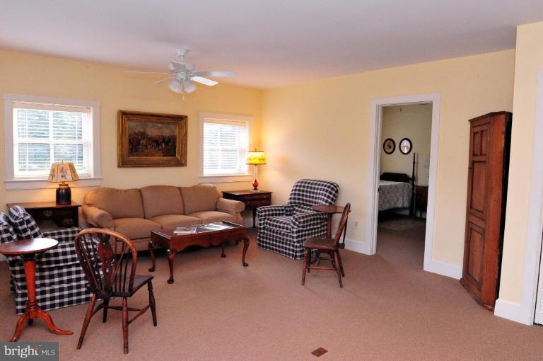 3032 Bull Run Mountain Road The Plains, VA 20198 - Photo 16 of 16 a living room with furniture a window and a flat screen tv
