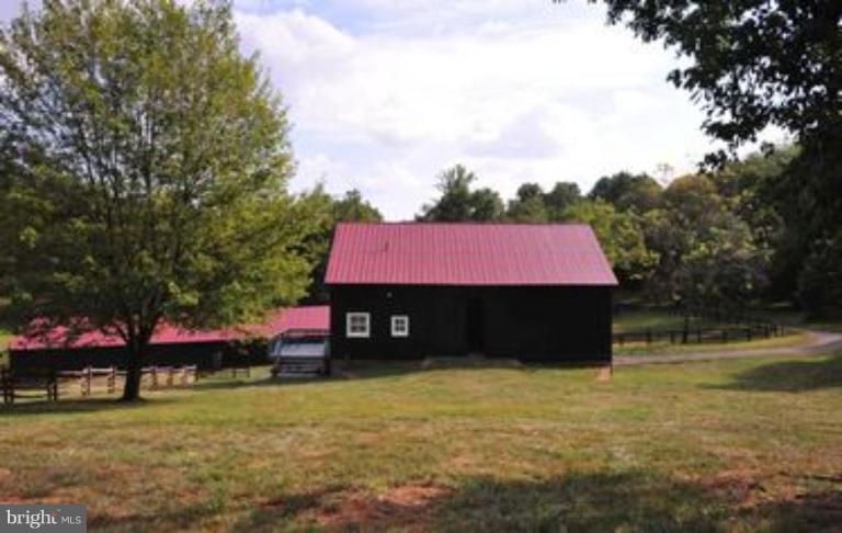 3032 Bull Run Mountain Road The Plains, VA 20198 - Photo 3 of 16 a front view of a house with a garden