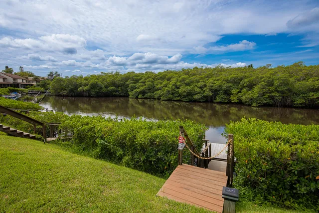 a view of a lake with a garden