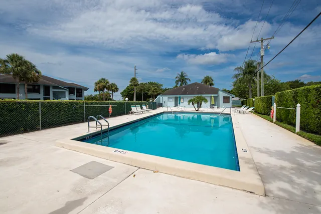 a view of a swimming pool with a patio
