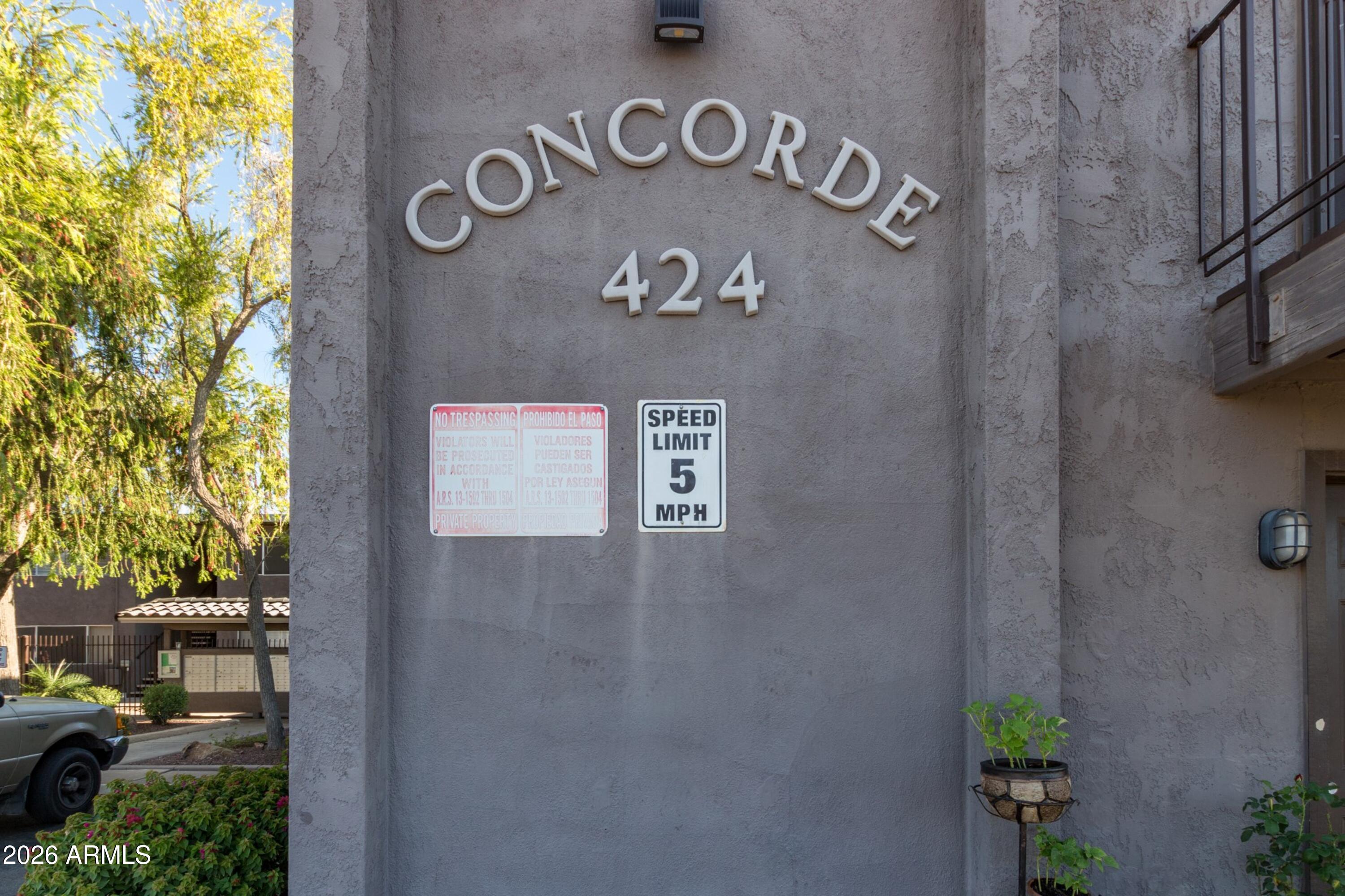 424 West Brown Road, Unit 248 Mesa, AZ 85201 - Photo 19 of 19 a view of a wall with signage and flags