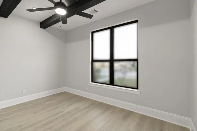 a kitchen with stainless steel appliances a refrigerator and cabinets