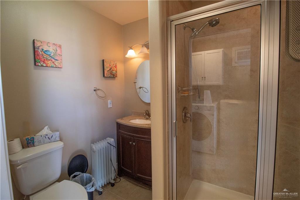 2138 Mazerron West Mercedes, TX 78570 - Photo 11 of 15 a bathroom with a toilet and a shower