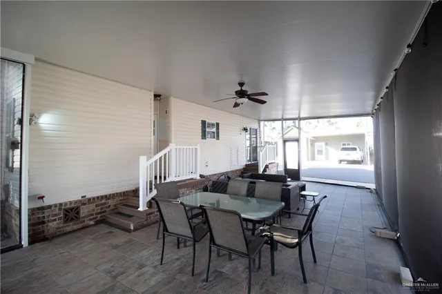 a dining room with furniture and window