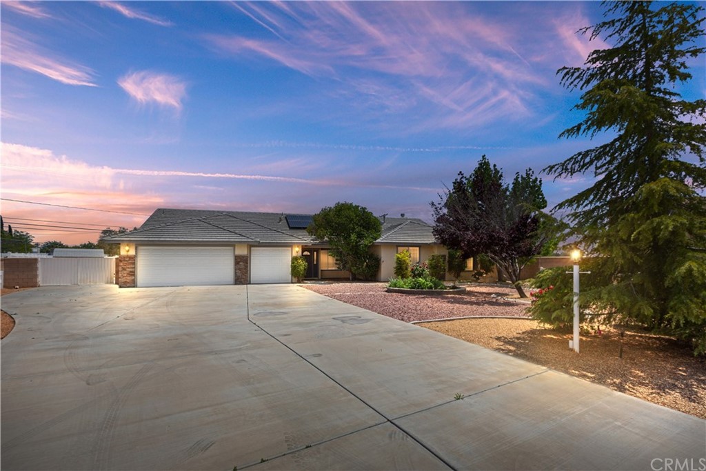 20451 Brazos Road Apple Valley, CA 92308 - Photo 1 of 1 a view of a house with a yard and large tree