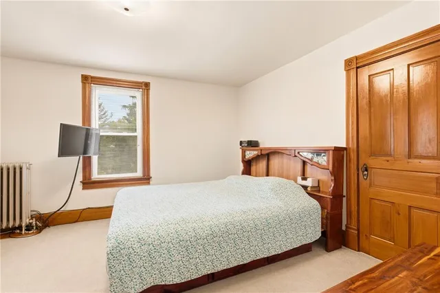 a white bath tub sitting next to a white toilet