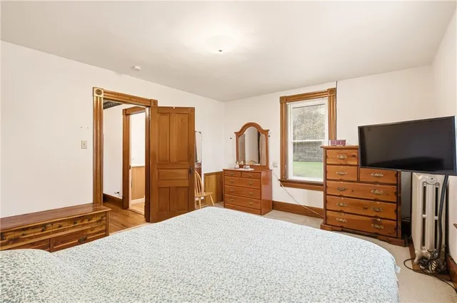 a view of a livingroom with workspace and a window