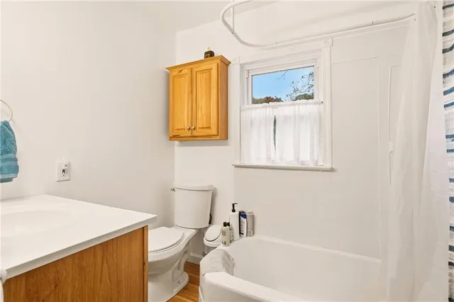 a bedroom with a bed and a table