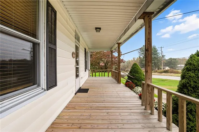 a view of living room with furniture and floor to ceiling window