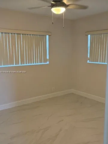 a view of an empty room with window