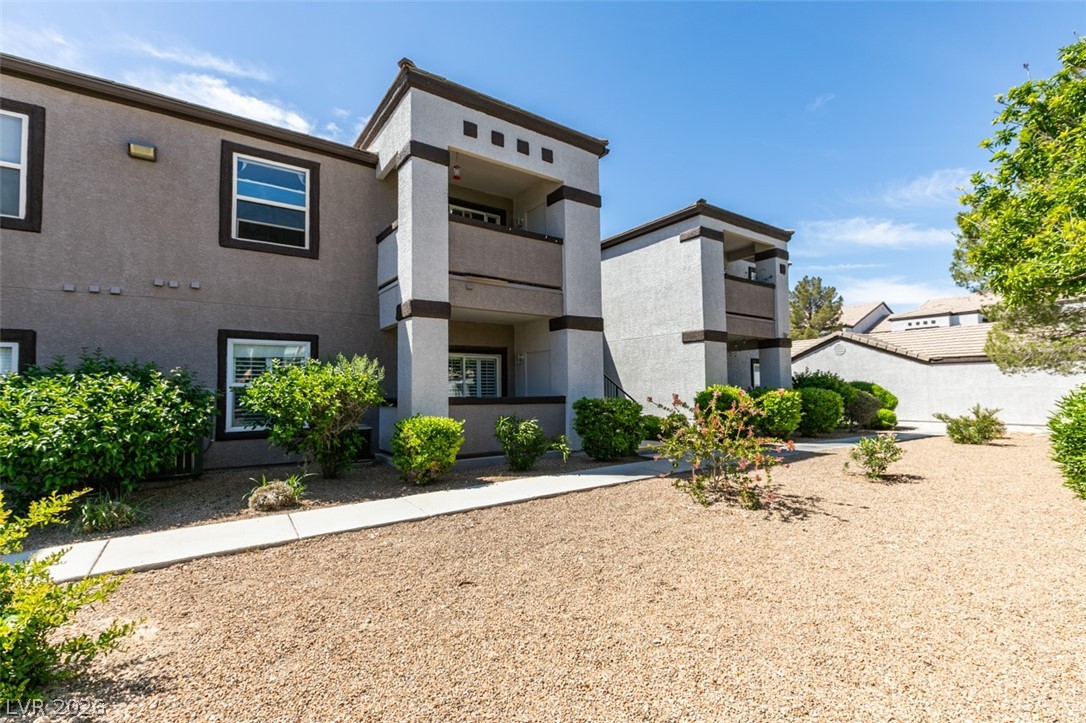 7255 West Sunset Road, Unit 1103 Las Vegas, NV 89113 - Photo 8 of 35 Well-maintained grounds enhance the curb appeal of this multi-story building, offering comfortable living.