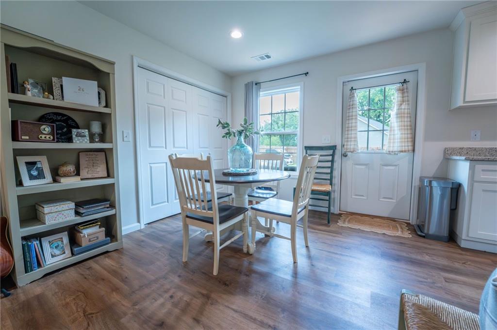 118 Wash Rider Road Dahlonega, GA 30533 - Photo 16 of 37 a view of a dining room with furniture and a book shelf