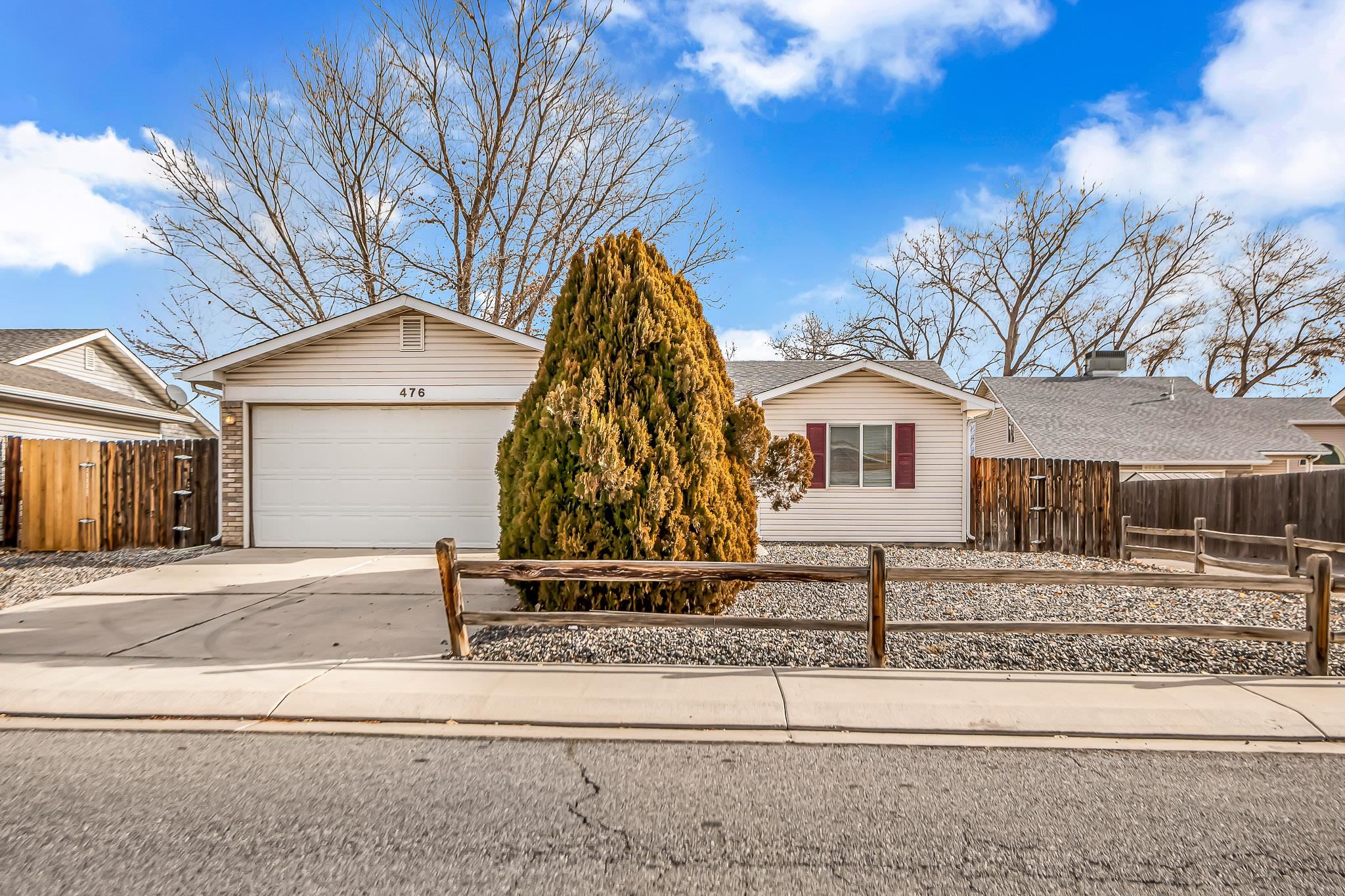 a view of a yard in front of a house