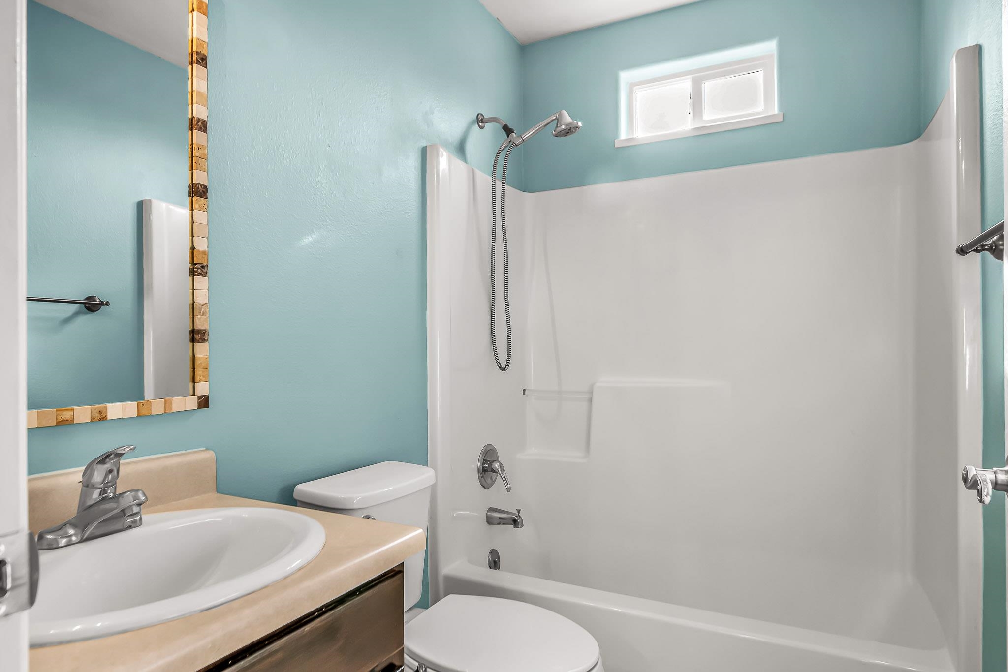 476 Ridge Lane Grand Junction, CO 81504 - Photo 13 of 22 a bathroom with a sink toilet and shower