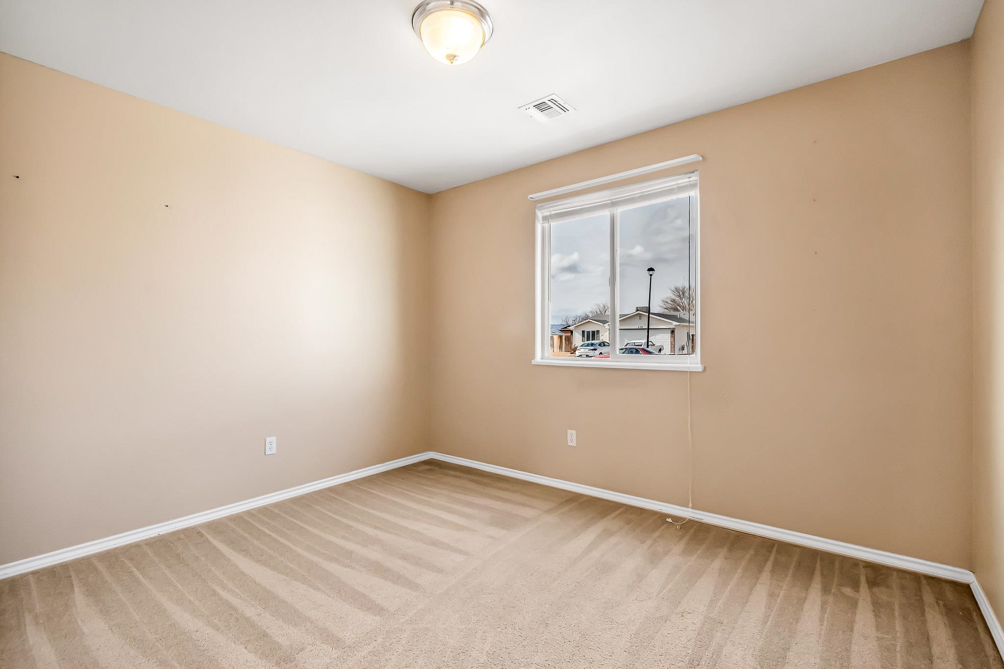476 Ridge Lane Grand Junction, CO 81504 - Photo 16 of 22 an empty room with a window