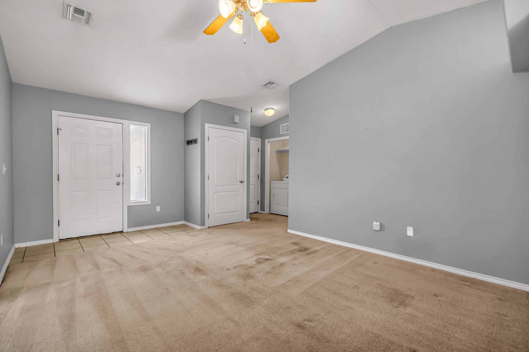 476 Ridge Lane Grand Junction, CO 81504 - Photo 2 of 22 a view of an empty room with a chandelier fan