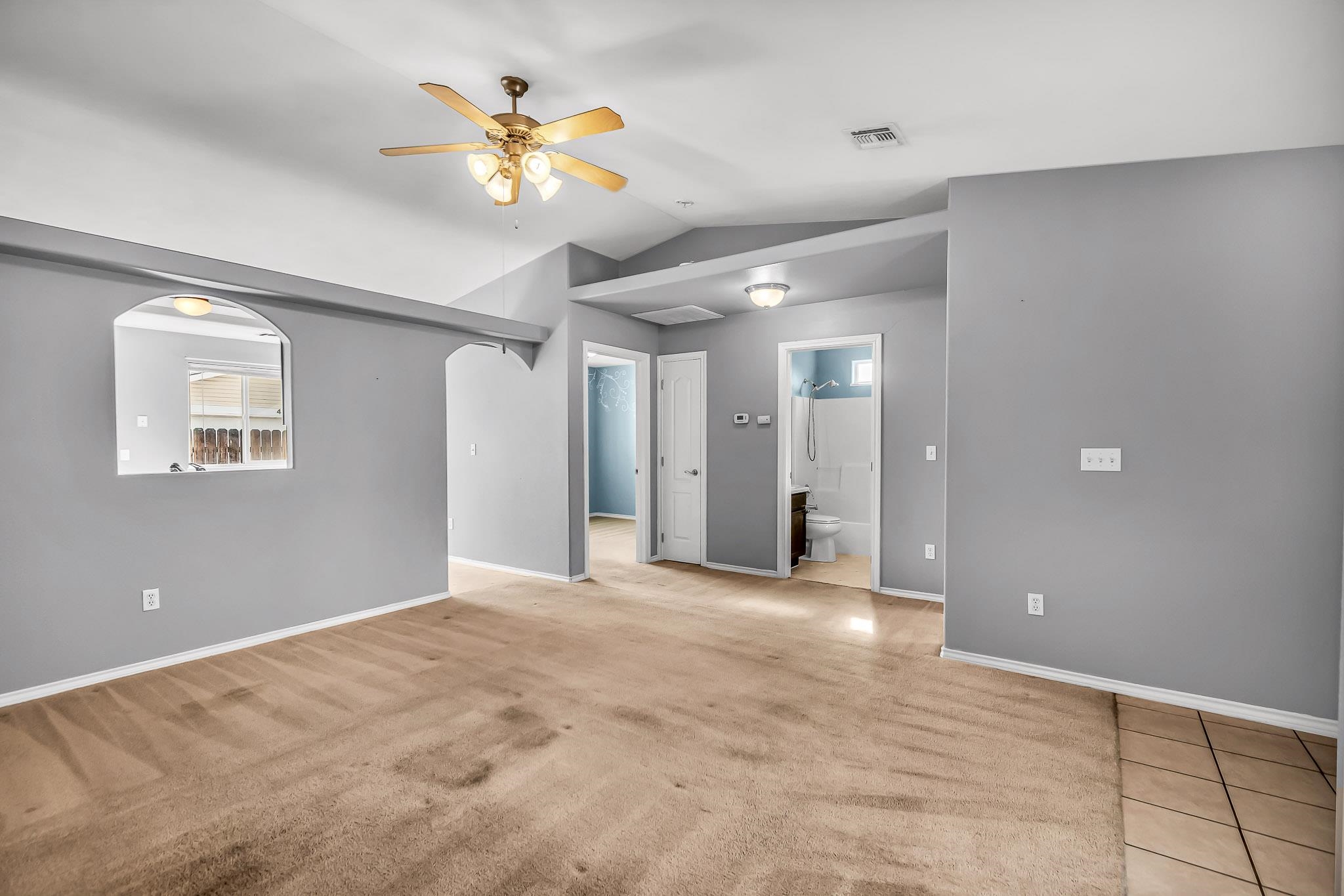 476 Ridge Lane Grand Junction, CO 81504 - Photo 6 of 22 a view of an empty room with a ceiling fan