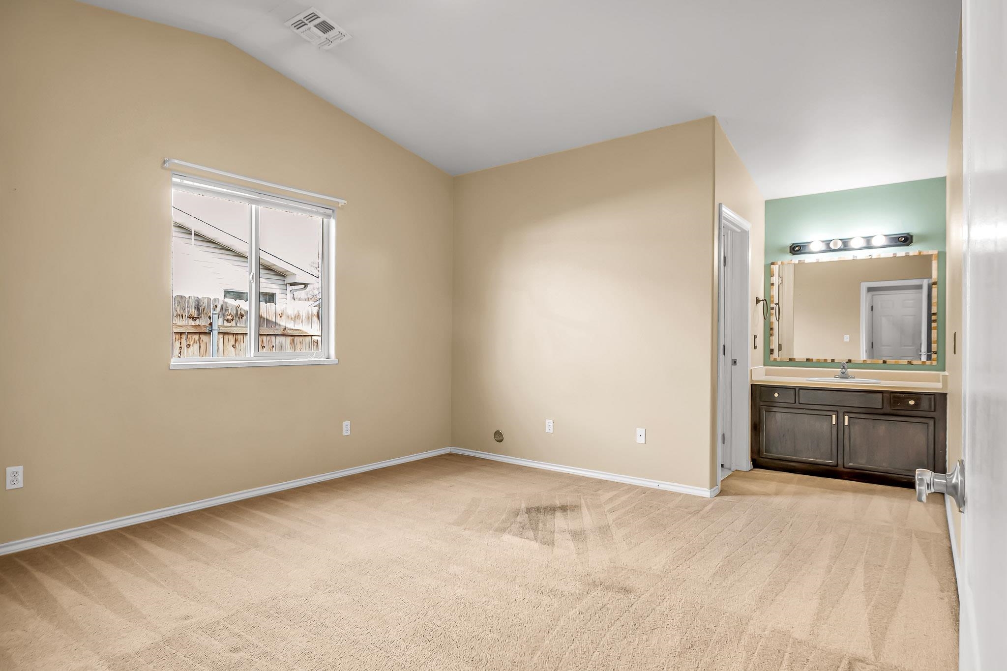 476 Ridge Lane Grand Junction, CO 81504 - Photo 7 of 22 a view of an empty room with window and cabinet