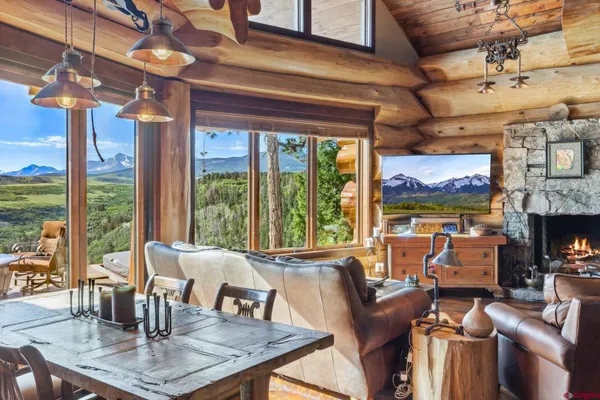 a table and chairs in a open kitchen