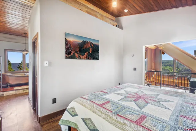 a view of a livingroom with furniture and hardwood floor