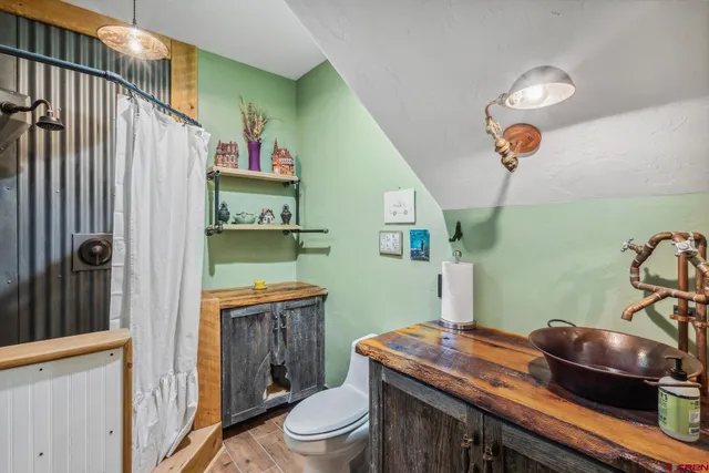 a view of a livingroom with furniture and staircase