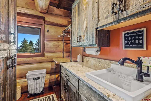 a view of a brick house with a tree