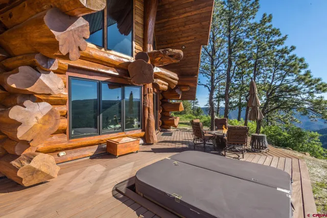 a view of a building with sitting area and furniture