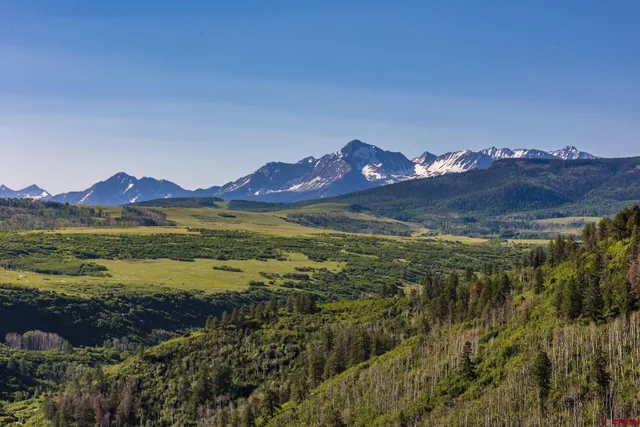 a view of ocean with a mountain