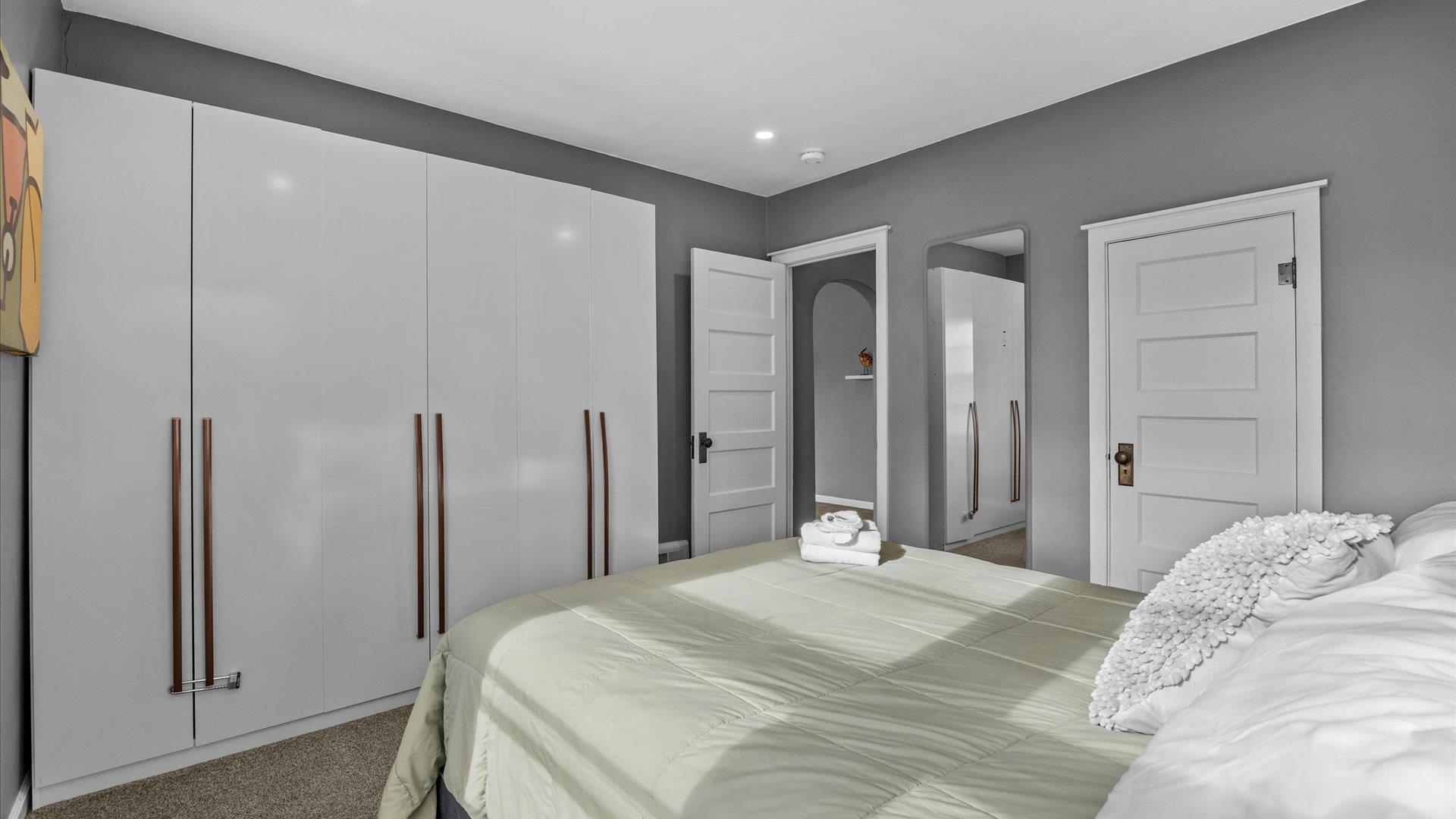 829 East Aspen Avenue Fruita, CO 81521 - Photo 11 of 27 a bedroom with a large bed and a closet