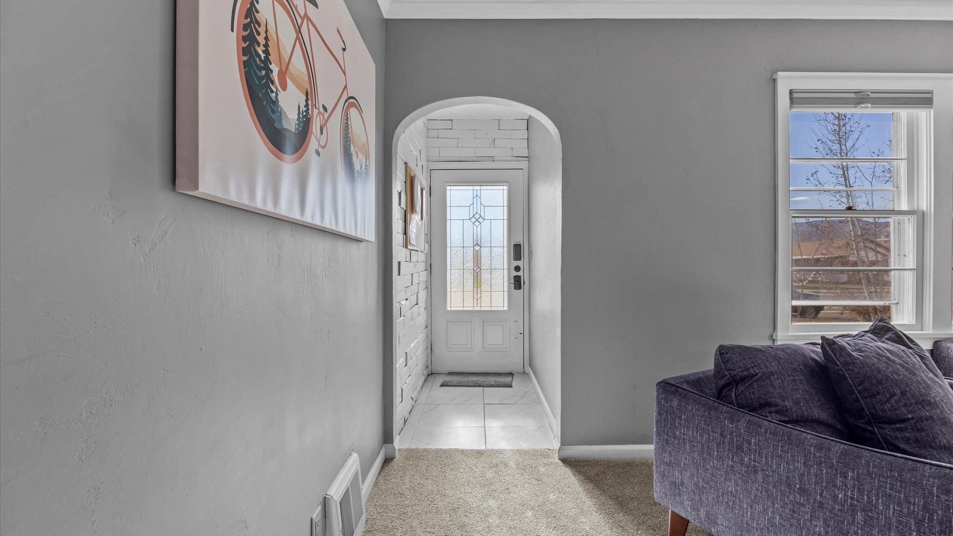 829 East Aspen Avenue Fruita, CO 81521 - Photo 5 of 27 a living room with furniture and a window