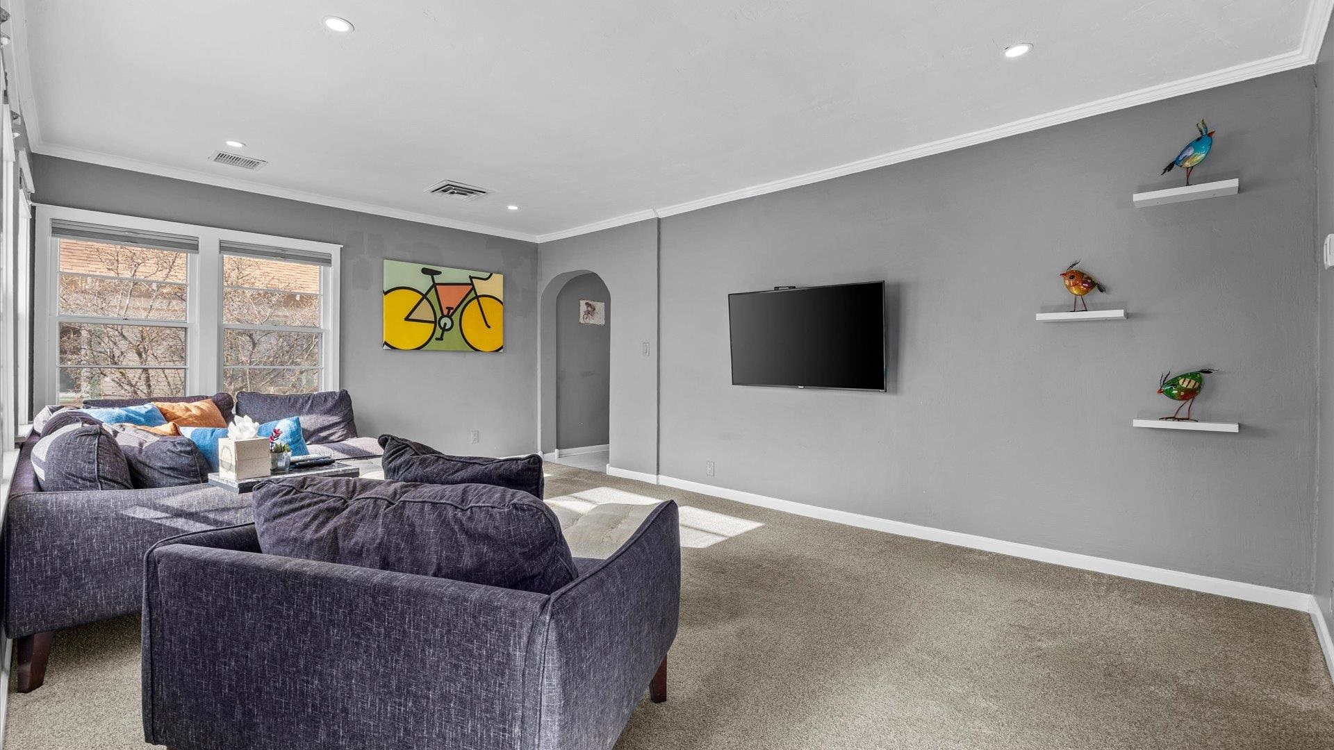 829 East Aspen Avenue Fruita, CO 81521 - Photo 6 of 27 a living room with furniture and a flat screen tv