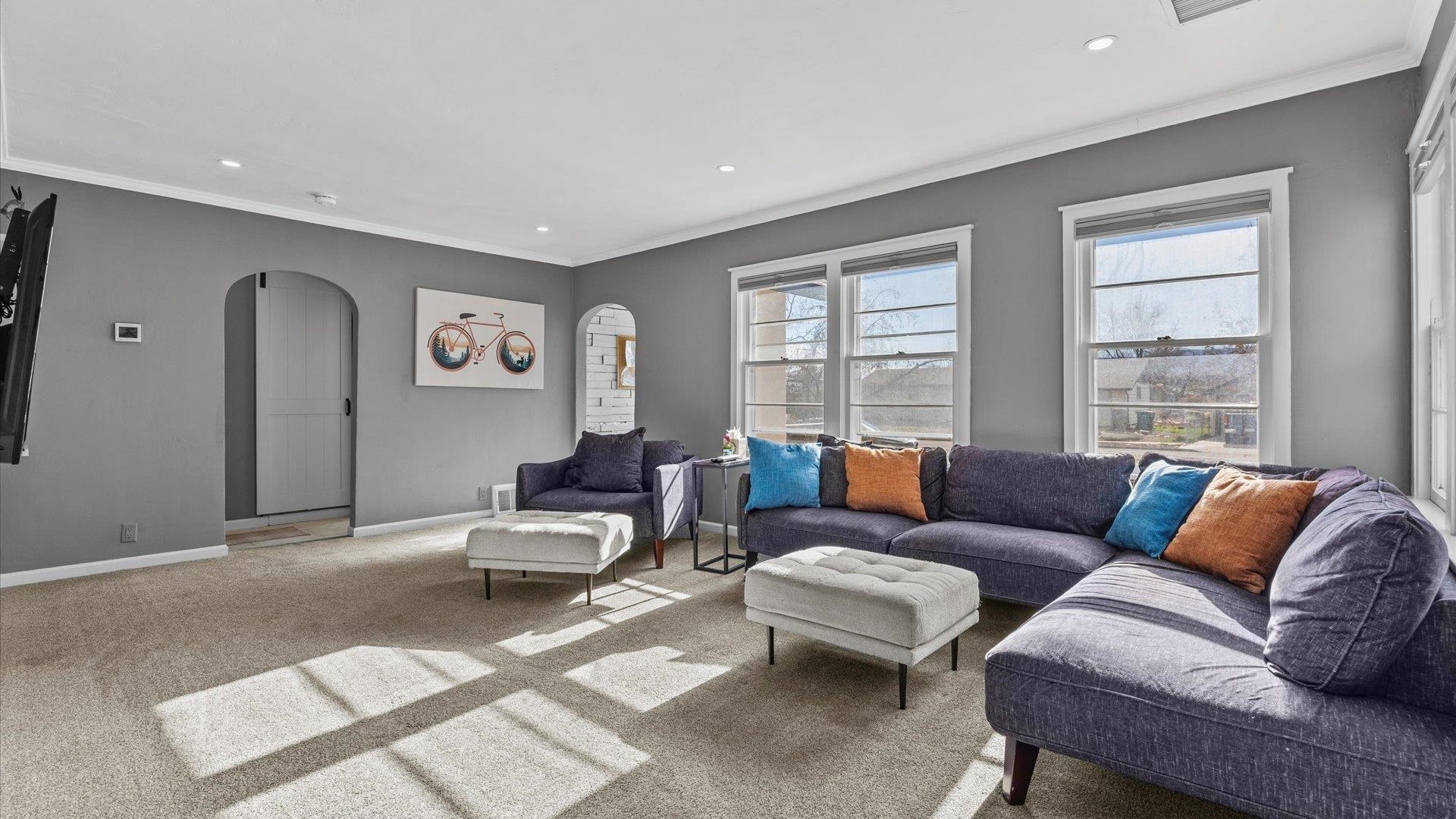 829 East Aspen Avenue Fruita, CO 81521 - Photo 7 of 27 a living room with furniture and large windows