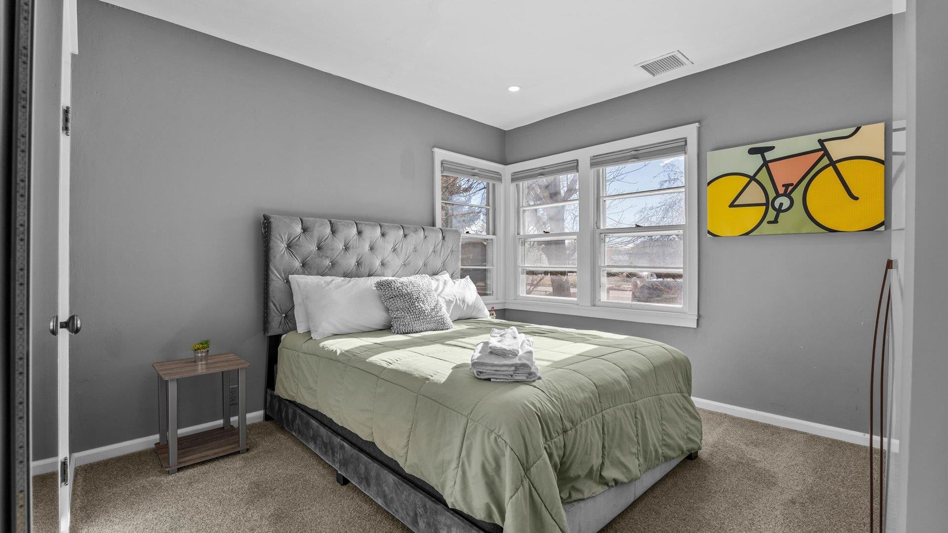 829 East Aspen Avenue Fruita, CO 81521 - Photo 10 of 27 a bedroom with a bed and window