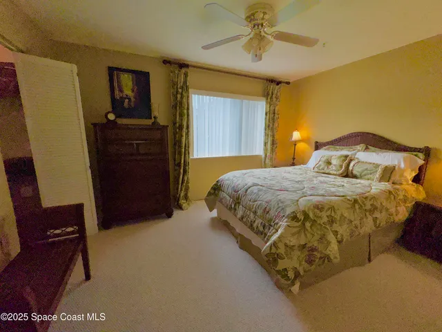 a bedroom with a bed and dresser