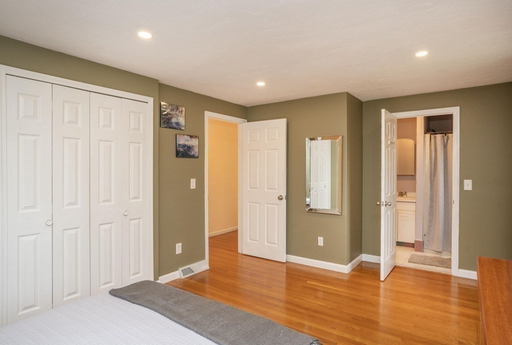 25 Sandy Ridge Road Stoughton, MA 02072 - Photo 19 of 42 a view of an empty room with wooden floor and a bathroom