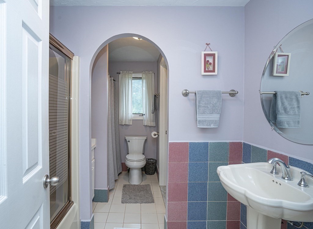 25 Sandy Ridge Road Stoughton, MA 02072 - Photo 21 of 42 a bathroom with a sink and a mirror
