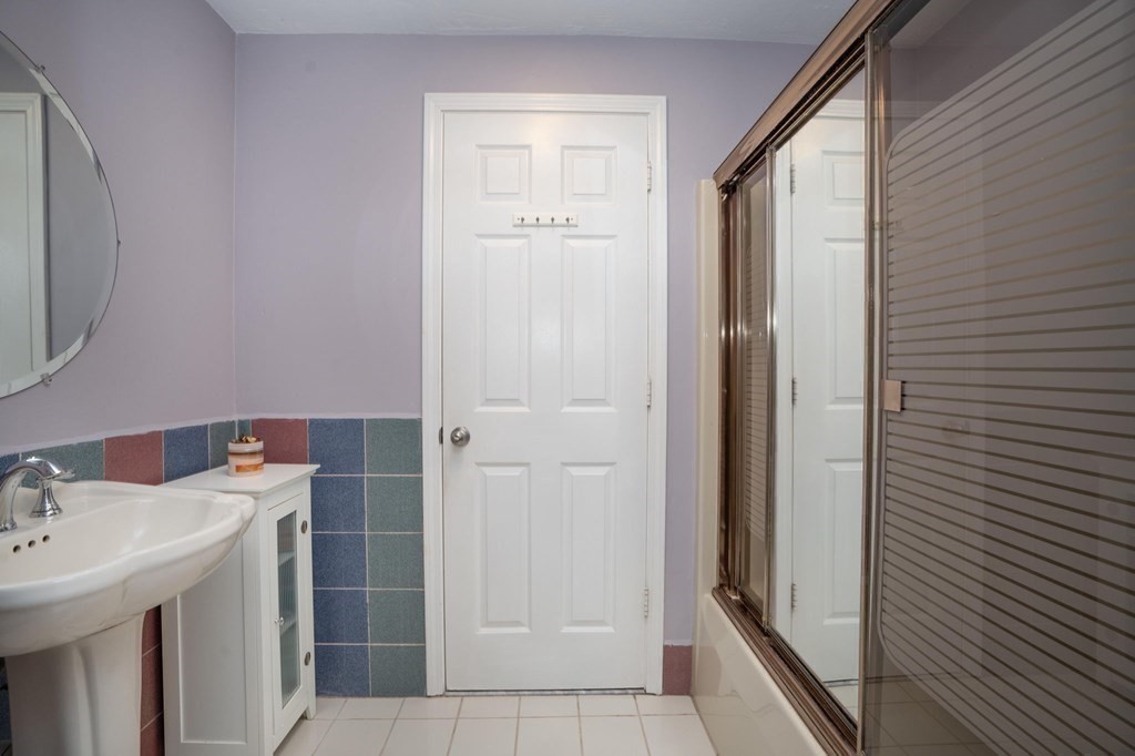 25 Sandy Ridge Road Stoughton, MA 02072 - Photo 22 of 42 a bathroom with a sink and mirror