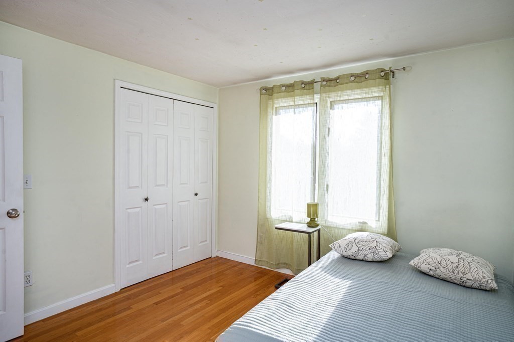 25 Sandy Ridge Road Stoughton, MA 02072 - Photo 26 of 42 a view of a room that has a window and bed in it